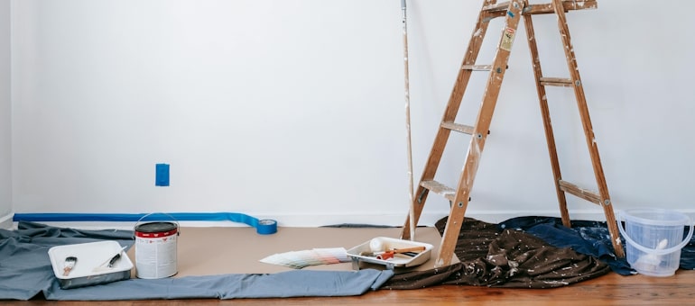 painting supplies in floor of house